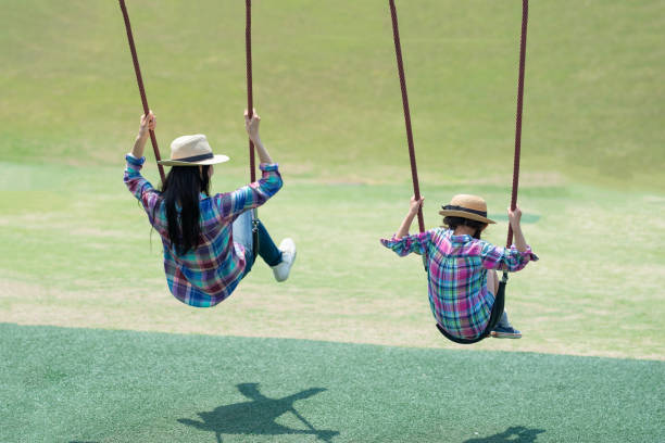istock Mother and daughter playing in the park 1148431160
