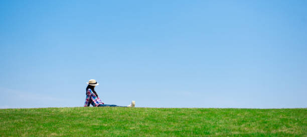 istock Beautiful woman relaxing in the meadow 1148431296