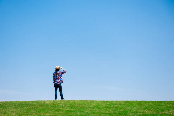 istock Beautiful woman relaxing in the meadow 1148431384