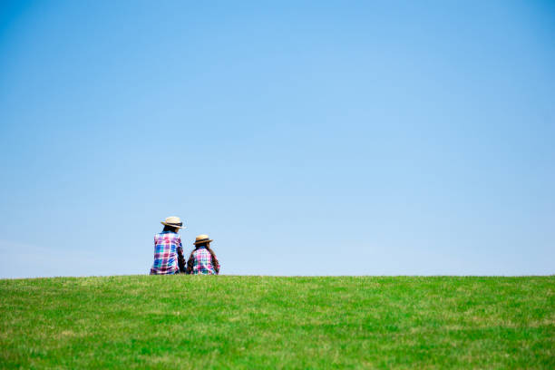 istock Mother and daughter playing in the meadow 1148431419