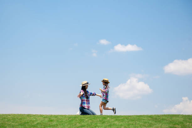 istock Mother and daughter playing in the meadow 1148432067