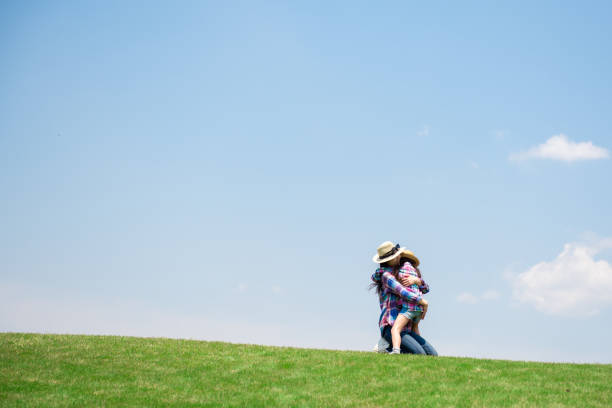 istock Mother and daughter playing in the meadow 1148432071