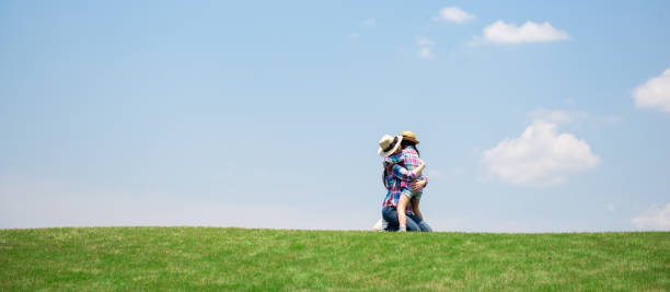 istock Mother and daughter playing in the meadow 1148432090