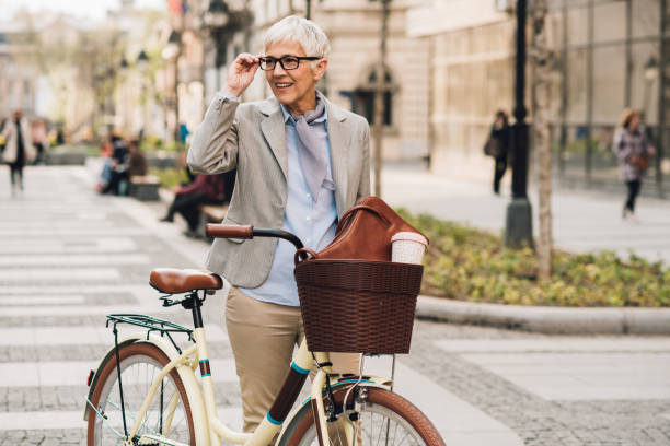 istock Senior woman on bicycle 1148432802