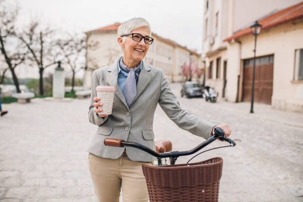 istock Woman drinking coffee by her bicycle 1148433434