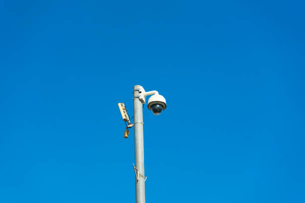 istock CCTV system against the blue sky, installed on a city street pole. 1148433966