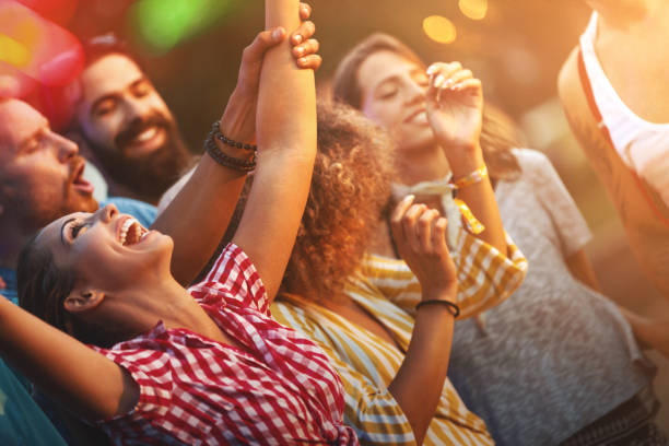 Friends dancing at a concert.