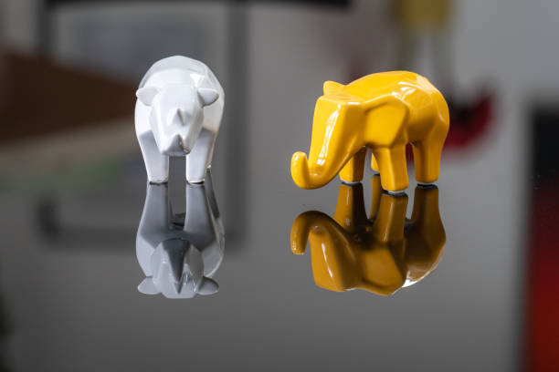 istock Animals in porcelain with reflection on a table 1148441476