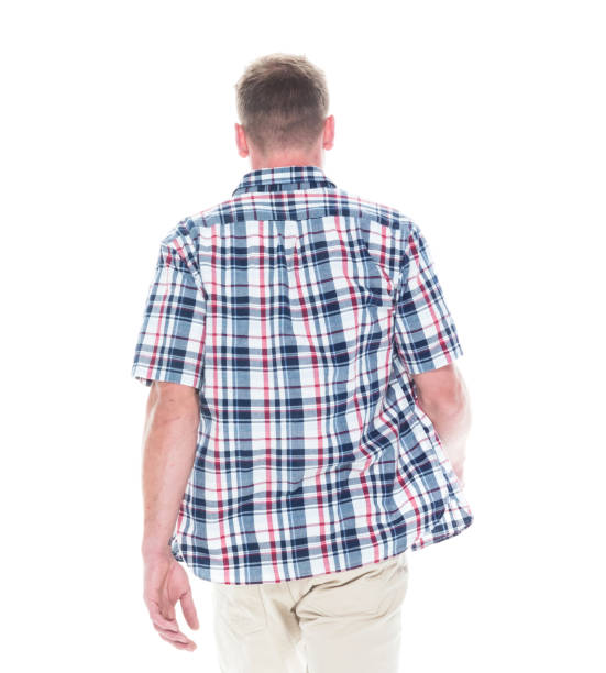 istock Handsome man in shirt and shorts is walking away 1148443070
