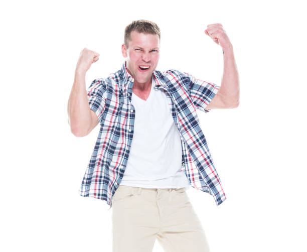 istock Handsome man in shirt and shorts is cheering with hands up 1148445285