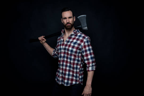 istock Attractive lumberjack man holding an axe 1148445635