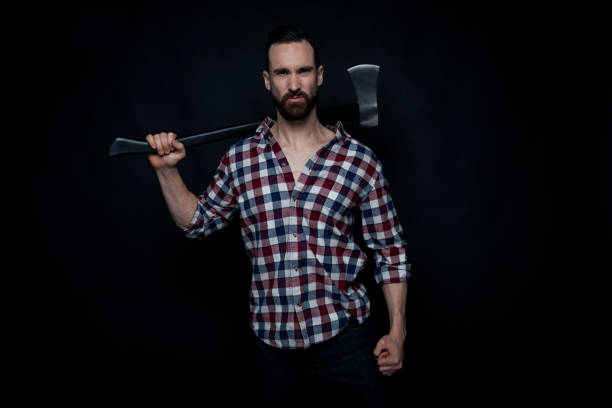 istock Attractive lumberjack man holding an axe 1148446742