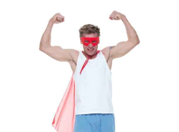 istock Man wearing pajamas and super hero cape 1148446812