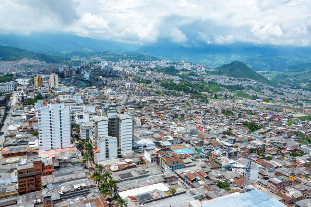 Cityscape view of Manizales, Colombia surrounded by lush green hills