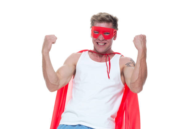 istock Man wearing pajamas and super hero cape 1148447133