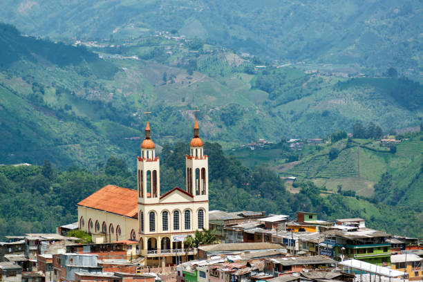 Church in Manizales, Colombia with lush green hills in the background