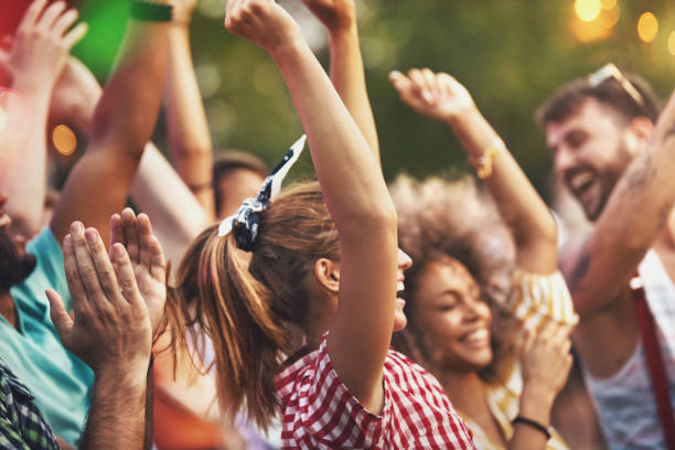 istock Friends dancing at a concert. 1148448189