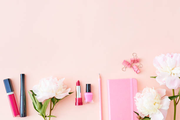 istock Blogger or freelancer workspace with notebook and light pink peonies on a pink background 1148450603