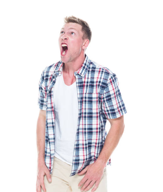 istock Handsome man in shirt and shorts is shouting 1148452341