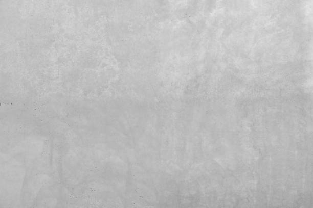 istock Grey concrete wall with rough surface. Stone wall with a slight structure of wear and tear. Large-format wall made of cement in industrial design style as wallpaper pattern, background or texture. 1148454112