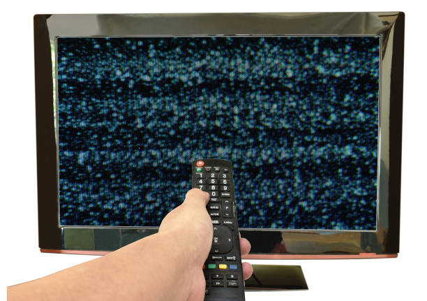 istock hand holding television remote control pointing to glitch on screen 1148454285