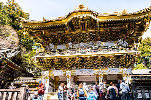 Nikko, Japan - April 5, 2019: Toshogu temple entrance shrine Yomeimon gate in Tochigi prefecture during spring with many people tourists