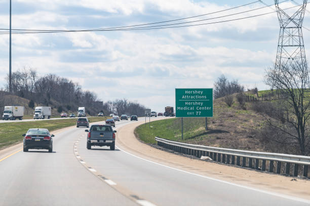 road sign to hershey attractions, medical center city in pennsylvania - hersheys imagens e fotografias de stock