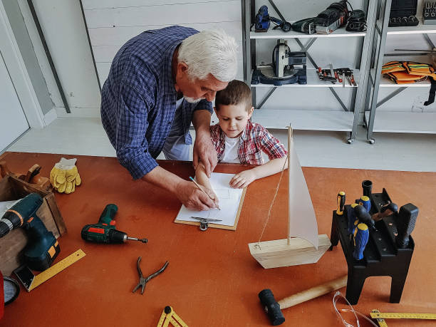 istock Grandfather teaching his grandson 1148459046