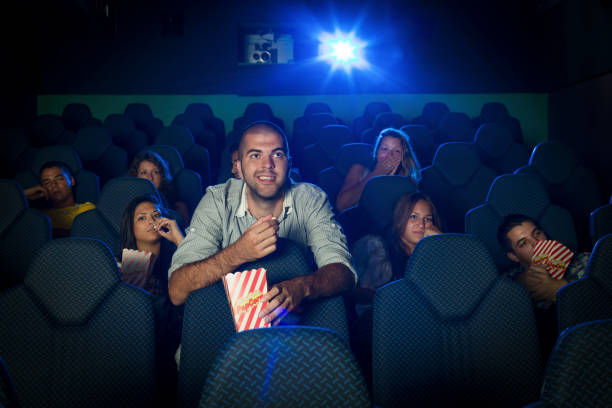 istock People watching a movie in cinema 1148460486