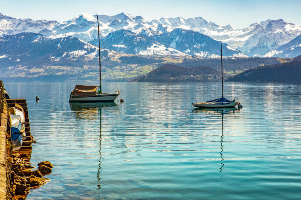 istock Boats sitting on calm Lake Thun 1148462380