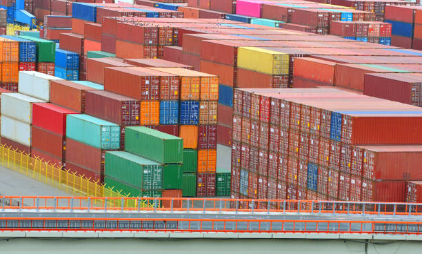 istock A lot of containers with cargo in a seaport. Logistic background. 1148465611