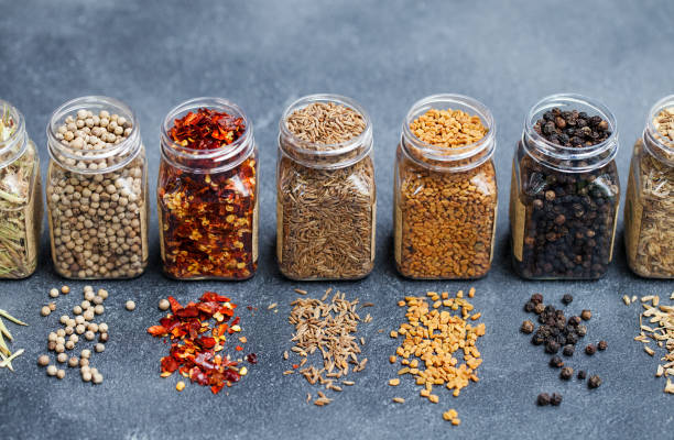 assortments of spices in jars on grey stone background. - ingredient fennel food dry imagens e fotografias de stock