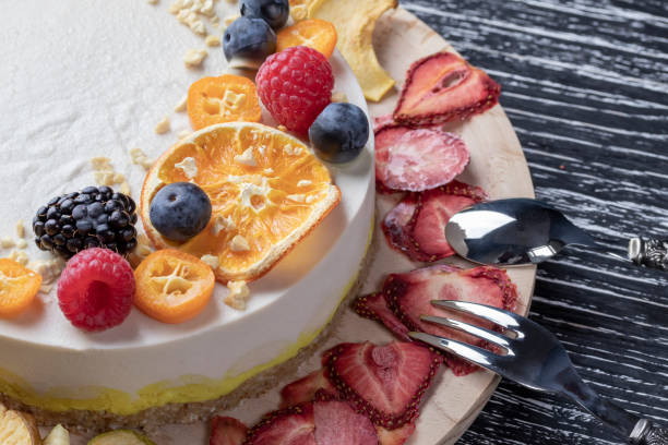 istock Dietary delicate fruity berry nut cake without baking. Wooden stand on a black table. 1148470411