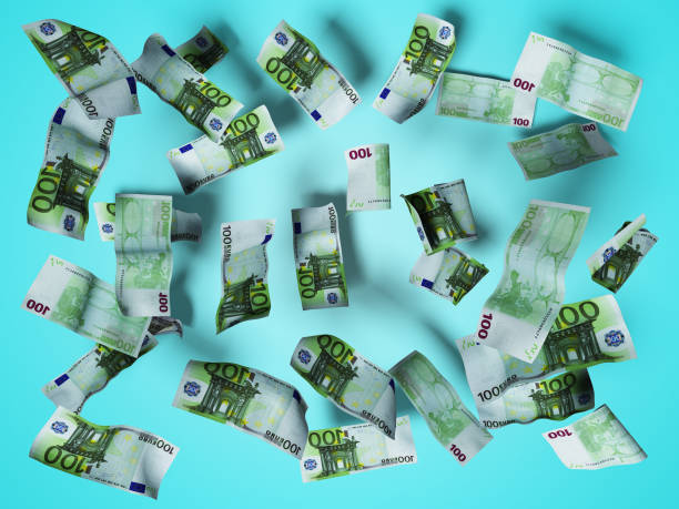 istock euro bills fly down on the floor 3d render on blue background with shadow 1148472876