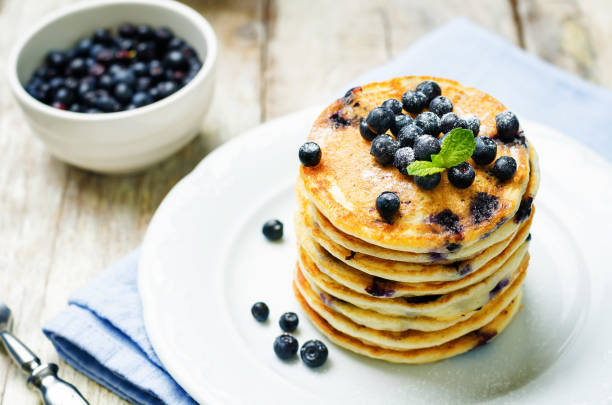 Blueberry Ricotta Pancakes with fresh blueberries and cup of coffee Blueberry Ricotta Pancakes with fresh blueberries and cup of coffee. toning. selective focus pancake photos stock pictures, royalty-free photos & images