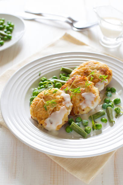 istock Fish cutlets with green peas and beans 1148494876