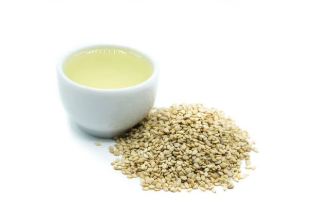 istock sesame oil isolated on white background 1148494962