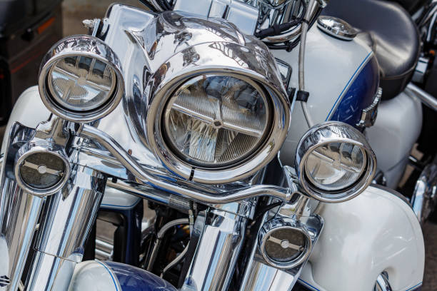 Moscow, Russia - May 04, 2019: Chrome headlights with direction indicators of Harley Davidson motorcycle closeup. Moto festival MosMotoFest 2019