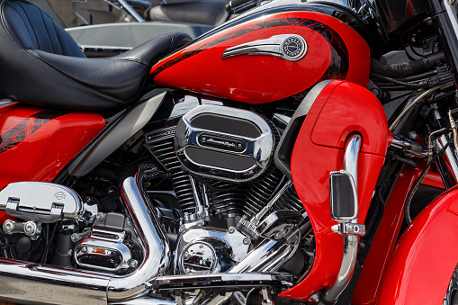 Moscow, Russia - May 04, 2019: Fragment of chrome engine with exhaust system pipes of Harley Davidson motorcycle. Moto festival MosMotoFest 2019