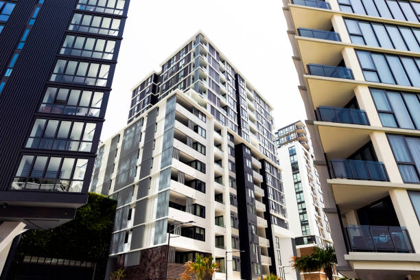 istock Low angle view of modern apartment buildings, sky background with copy space 1148505852