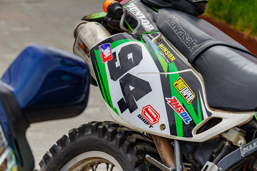Moscow, Russia - May 04, 2019: Rear wheel and exhaust system pipe of Kawasaki sports motorcycle closeup. Moto festival MosMotoFest 2019