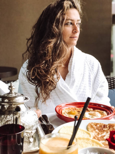 istock woman at the table for the buffet breakfast with fruit 1148508083
