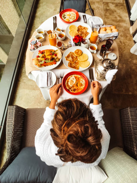 woman at the table for the buffet breakfast with fruit