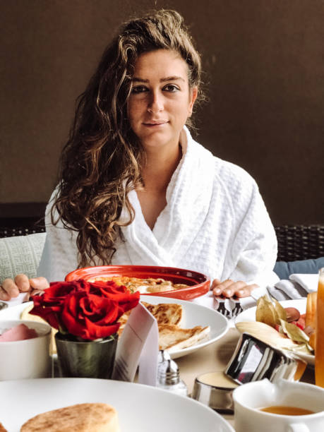 istock woman at the table for the buffet breakfast with fruit 1148508198