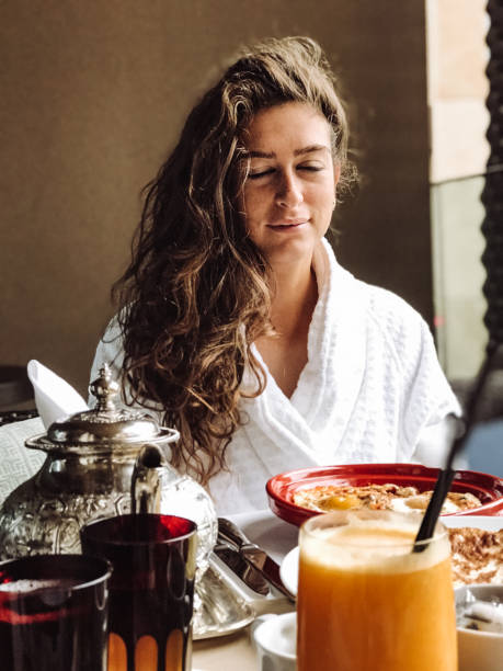 istock woman at the table for the buffet breakfast with fruit 1148508215