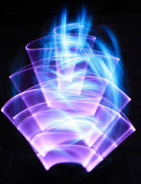 Shapes made with laser sword in lightpainting Curved shape made of neon and white streaks made to optical fiber at lightpainting lightpainting stock pictures, royalty-free photos & images