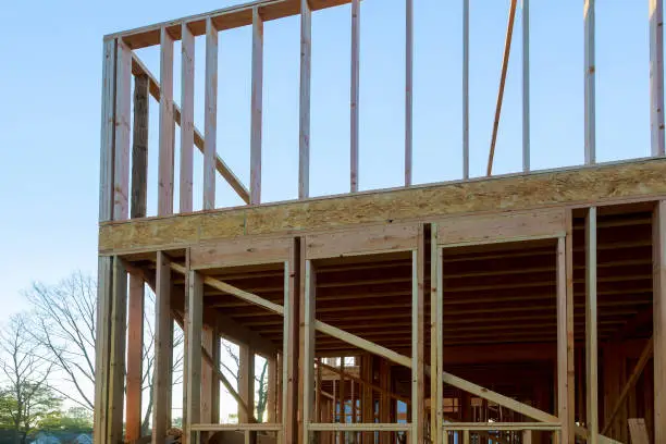 House under construction framing beam building front home