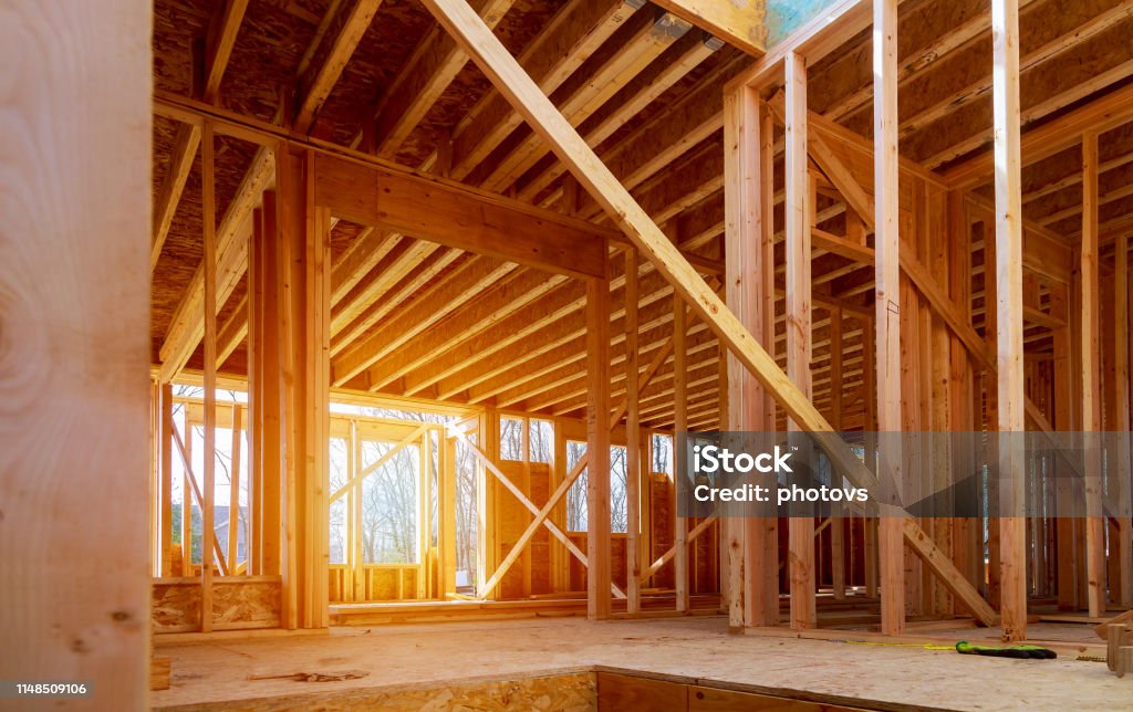 Interior view of a house under construction Interior view of a house under construction home framing Construction Industry Stock Photo