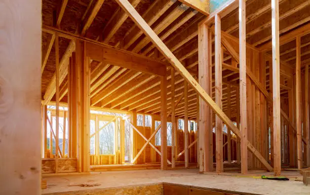 Interior view of a house under construction home framing