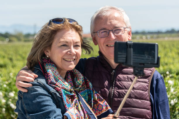 istock Senior couple taking a selfie at the vineyard 1148509246